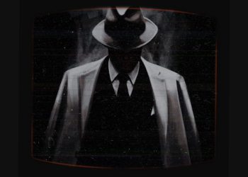 There is no photo of Louis Arcuri. This is a photo of a man standing in the shadows, face hidden. He is wearing a white topcoat and fedora.