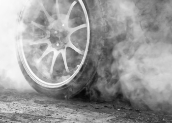 A photo of a car tire ready to peel rubber.