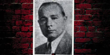 A mugshot of mobster Antonio Vadala featuring a pinned photograph on a brick background with the BG logo at the bottom.