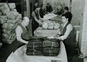 A photo of workers in New York's garment district in the 1950s packaging garments.