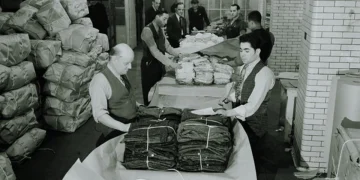 A photo of workers in New York's garment district in the 1950s packaging garments.