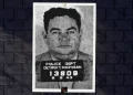 Mugshot of Vicious Detroit Hoodlum Joe Massei featured on Button Guys signature brick background for Joe Massei bio.